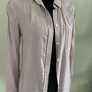 Woman’s purple and white striped button down shirt